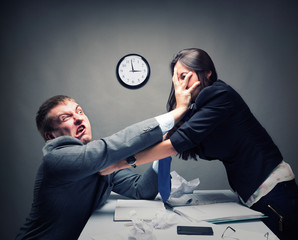 Two young caucasian office worker starting to fight