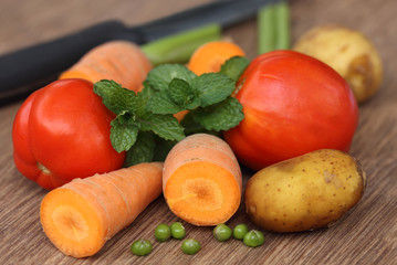 Fresh vegetables on a wooden surface