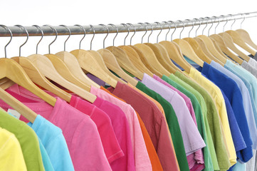 colorful shirts on wooden hangers