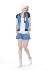 Shot of fashionable girl in leisure clothing posing in studio