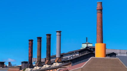 Old Victorian style Factory with chimneys
