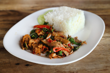 Fried pork with sweet basi and white jasmine sticky rice