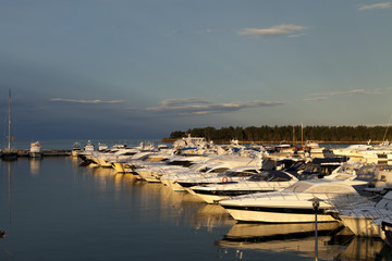 Fototapeta na wymiar Large yacht harbor in the sunrise before storm