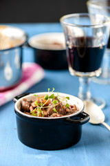 boeuf bourguignon classic french beef stew on blue table with a