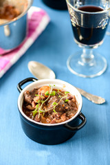 boeuf bourguignon classic french beef stew on blue table with a