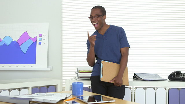 African American business man smiling in office