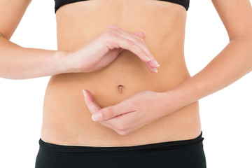 Close-up mid section of a fit woman with hand gestures