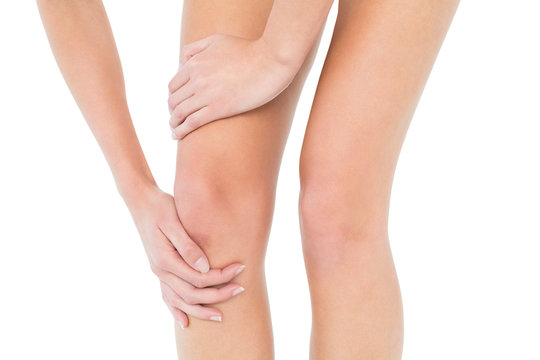 Close-up mid section of a woman with knee pain