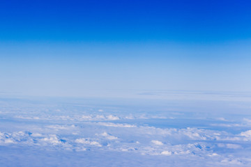 Fototapeta na wymiar clouds. top view from the window of an airplane flying in the cl