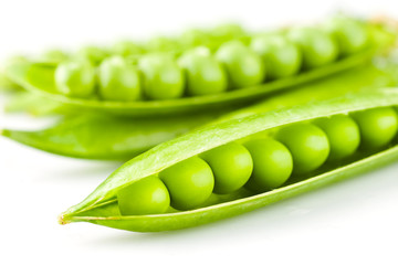 Fresh peas isolated on white background