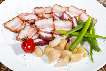 bacon, onion and pepper on a plate in a restaurant