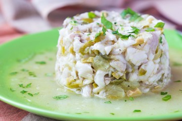 Tartar ceviche of raw white fish with olives, lemon, sauce