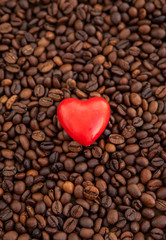 Red heart on coffee beans