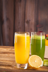 Composition with glass of orange and cucumber juice 