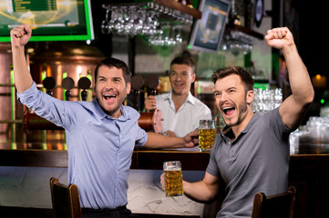 Watching TV in bar.
