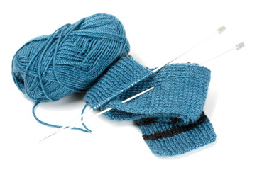 striped scarf on knitting needles