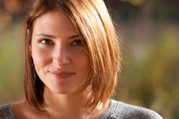 Fototapeta premium Portrait of young beautiful woman on green background