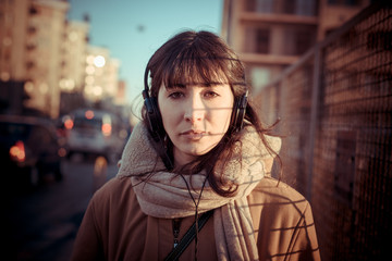 Fototapeta premium beautiful young woman listening to music headphones