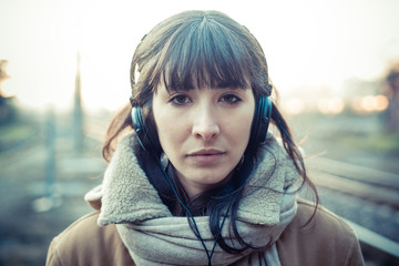 beautiful young woman listening to music headphones