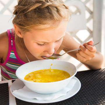 Cute Child Eating Soup