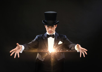 magician in top hat showing trick - obrazy, fototapety, plakaty