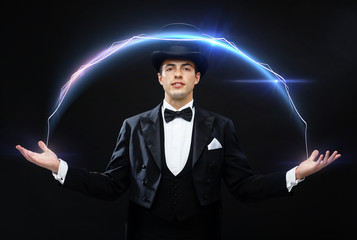 magician in top hat showing trick