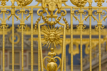 Golden ornate gate of Chateau de Versailles