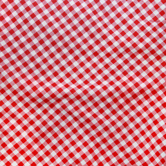 Background texture of a crumpled red and white textile