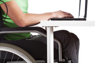 Obraz premium Disabled man sitting at a desk