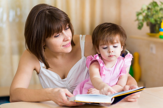 mom and kid read a book