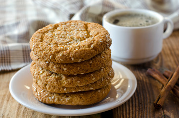 Cookies on a wooden table with a cup of coffee