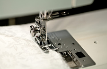 sewing needles on a white cloth