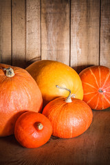 Pumpkins on grunge wooden backdrop background