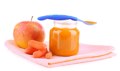 Baby food with carrot and apple in glass jars, isolated on