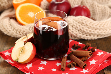 Fragrant mulled wine in glass on napkin close-up