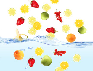 Fresh fruits dropped into water