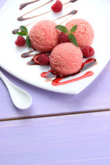 Delicious ice cream on plate on table close-up