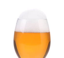 Closeup of beer glass with foam.
