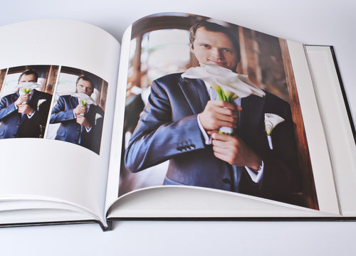 Wedding photo book of elegant young caucasian groom