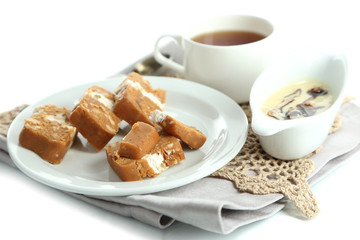 Sherbet with nuts on plate isolated on white