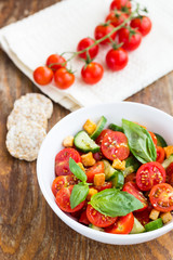 Tomato salad with cucumber and croutons