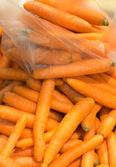Raw carrots healthy vegetables at market as food background