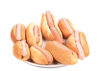 Bunch of hotdogs on plate.