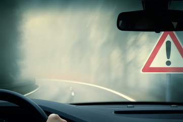 bad weather driving - foggy hazy country road