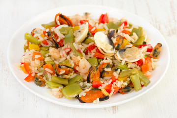 rice with seafood and vegetables on plate