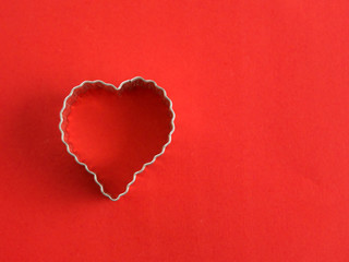 Naklejka na ściany i meble Heart shape on a red background