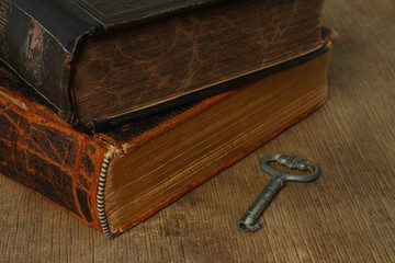 Retro composition with books on wooden background .