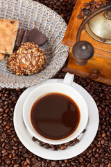 cup of coffee and roasted beans