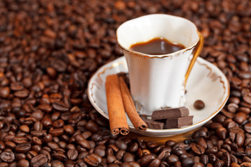 cup of coffee and roasted beans