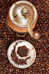 cup of coffee and roasted beans